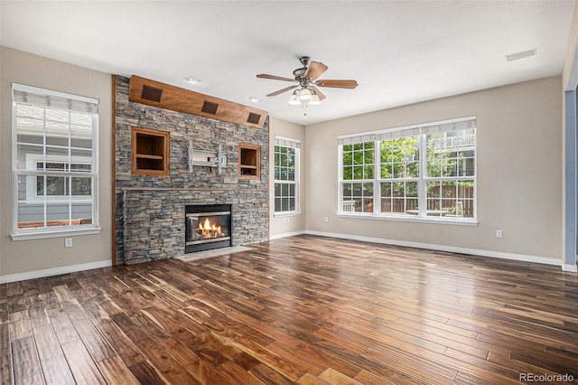 3389 Willowrun Dr, Castle Rock, CO 80109 - unfurnished living room with ceiling fan, wood finished floors, baseboards, and a fireplace