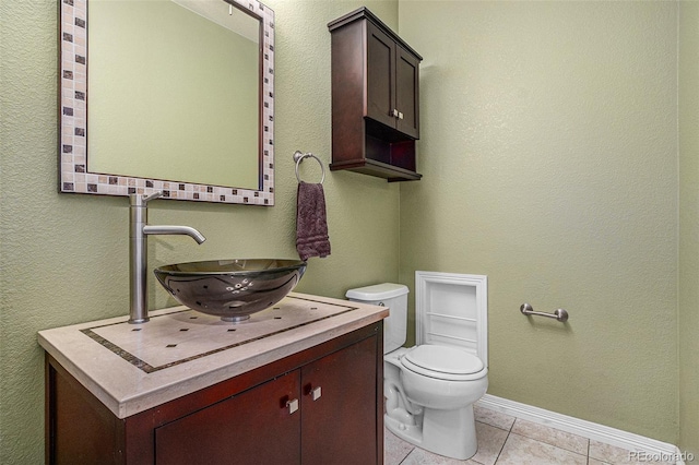 3389 Willowrun Dr, Castle Rock, CO 80109 - half bathroom with vanity, toilet, tile patterned flooring, and baseboards