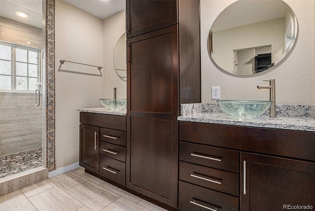 3389 Willowrun Dr, Castle Rock, CO 80109 - full bath with a shower stall, two vanities, and baseboards