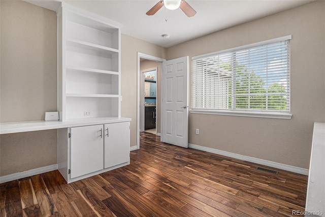 3389 Willowrun Dr, Castle Rock, CO 80109 - unfurnished bedroom featuring baseboards, dark wood-type flooring, and ceiling fan