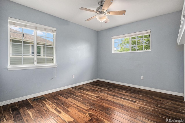 3389 Willowrun Dr, Castle Rock, CO 80109 - spare room featuring dark wood finished floors, baseboards, and ceiling fan