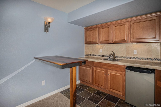 3389 Willowrun Dr, Castle Rock, CO 80109 - kitchen with dishwasher, tasteful backsplash, baseboards, and brown cabinetry