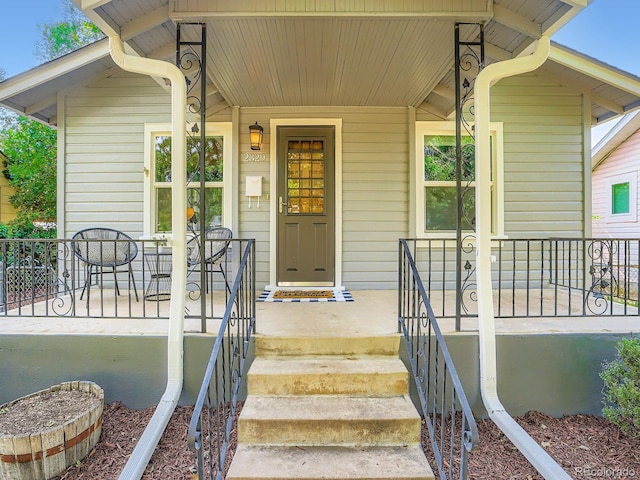 2329 S Gilpin St, Denver, CO 80210 - view of exterior entry featuring covered porch