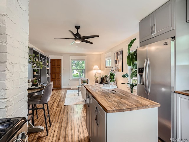 2329 S Gilpin St, Denver, CO 80210 - kitchen featuring wood counters, stainless steel appliances, wood finished floors, ceiling fan, and gray cabinets