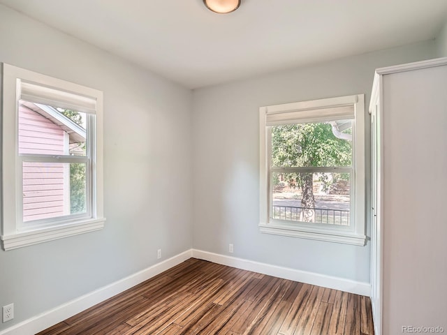 2329 S Gilpin St, Denver, CO 80210 - unfurnished room with dark wood-style floors and baseboards
