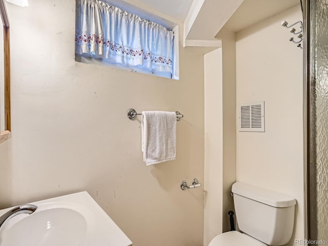 2329 S Gilpin St, Denver, CO 80210 - bathroom featuring toilet and vanity