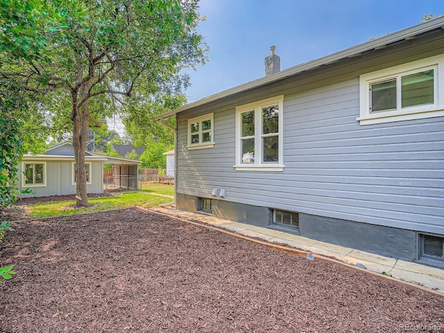 2329 S Gilpin St, Denver, CO 80210 - view of property exterior featuring a chimney