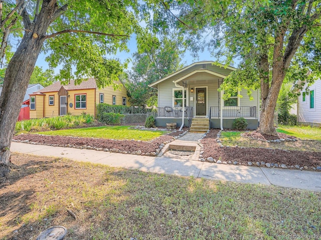 2329 S Gilpin St, Denver, CO 80210 - bungalow-style house featuring a porch and a front lawn