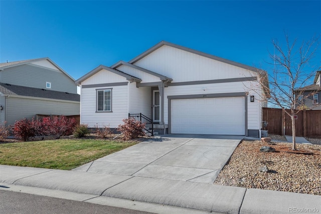 single story home with a front yard and a garage