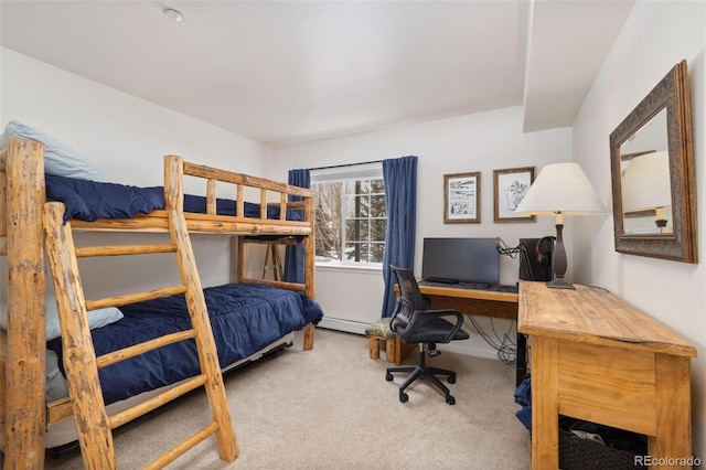 bedroom with a baseboard heating unit and carpet flooring