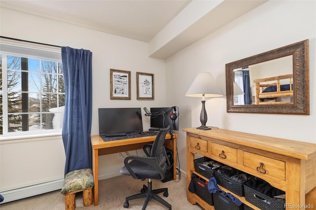 carpeted office with a baseboard radiator and baseboards