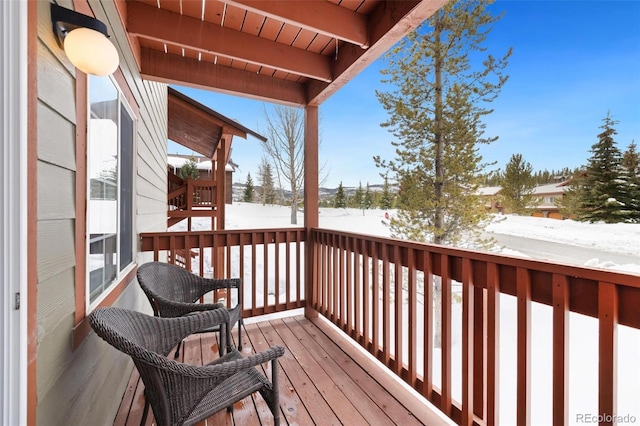 view of snow covered deck