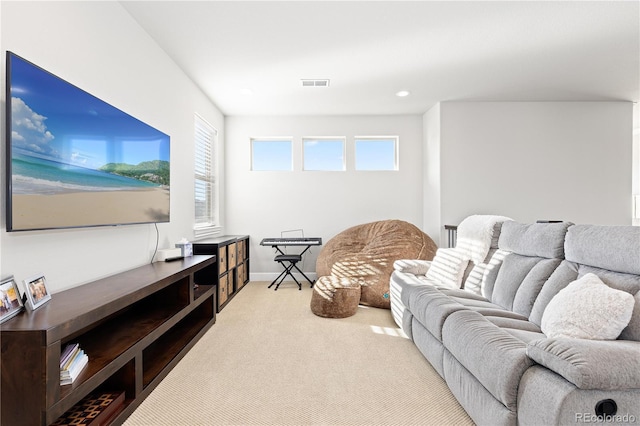 carpeted living room featuring recessed lighting, plenty of natural light, baseboards, and visible vents