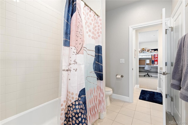 bathroom featuring tile patterned floors, shower / bath combo with shower curtain, toilet, and baseboards