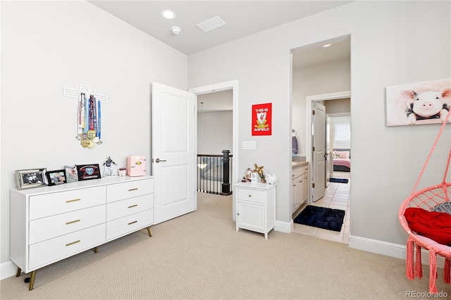 bedroom with recessed lighting, light colored carpet, and baseboards