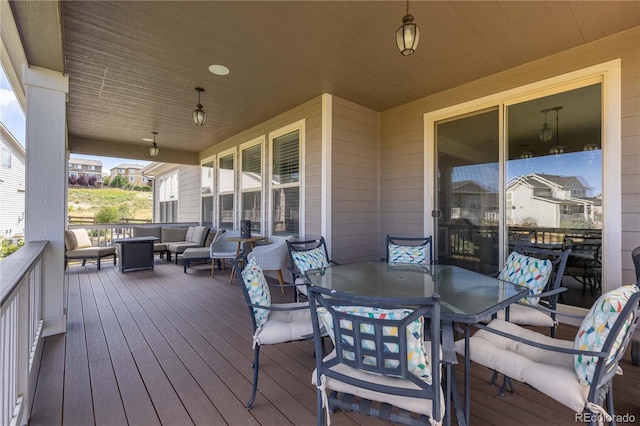 deck featuring outdoor dining area