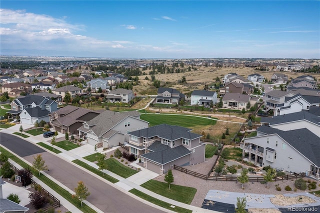 birds eye view of property with a residential view