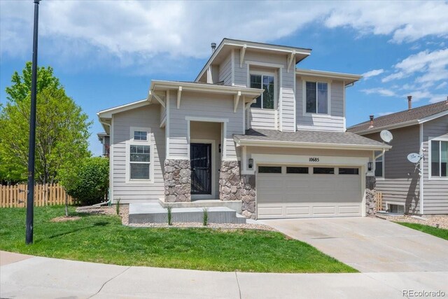 10685 Cherrybrook Cir, Highlands Ranch, CO 80126 - view of front of home with a garage, concrete driveway, and stone siding