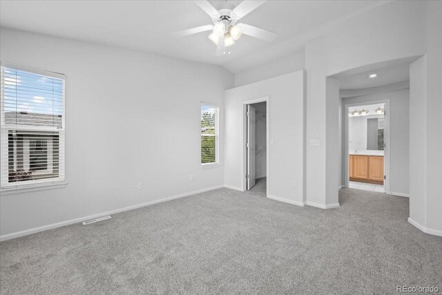 10685 Cherrybrook Cir, Highlands Ranch, CO 80126 - unfurnished bedroom featuring carpet floors, baseboards, a walk in closet, and ceiling fan