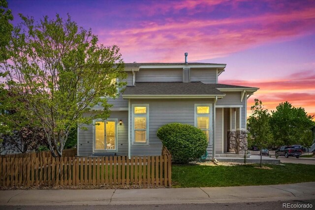 10685 Cherrybrook Cir, Highlands Ranch, CO 80126 - view of front of house featuring a fenced front yard and roof with shingles