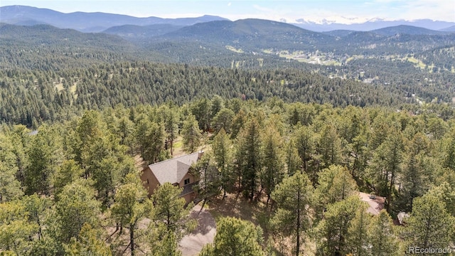 4992 White House Trl, Evergreen, CO 80439 - aerial view of a forest and a mountain backdrop