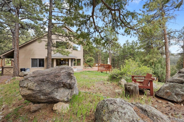 4992 White House Trl, Evergreen, CO 80439 - view of yard with a wooden deck