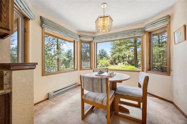 4992 White House Trl, Evergreen, CO 80439 - dining room featuring a baseboard heating unit, carpet flooring, a chandelier, and baseboards
