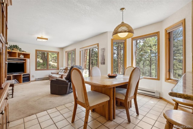 4992 White House Trl, Evergreen, CO 80439 - dining area with a baseboard radiator, light tile patterned floors, light colored carpet, a textured ceiling, and baseboards
