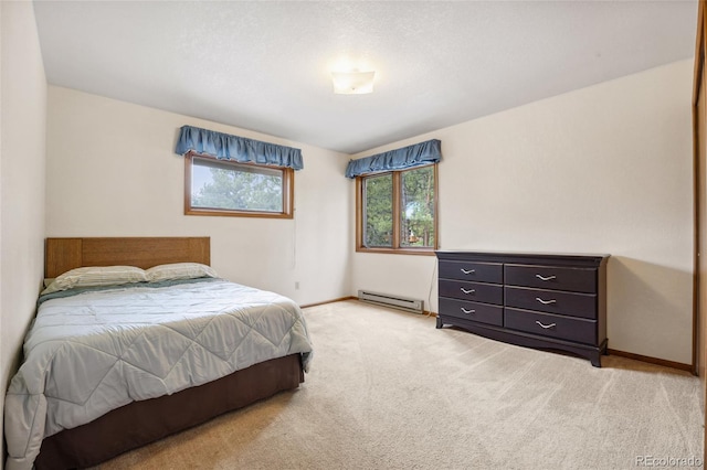 4992 White House Trl, Evergreen, CO 80439 - bedroom with a baseboard radiator, light colored carpet, and baseboards