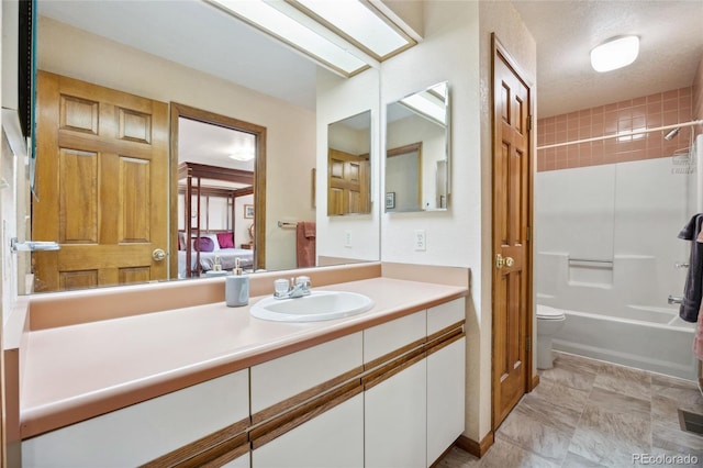 4992 White House Trl, Evergreen, CO 80439 - ensuite bathroom featuring vanity, toilet, and bathing tub / shower combination