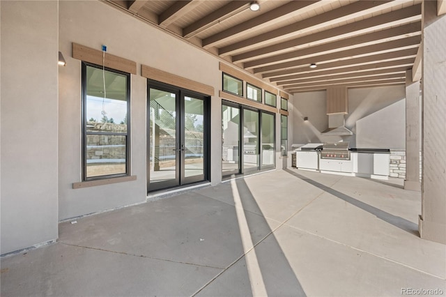 view of patio / terrace featuring a grill, exterior kitchen, and french doors