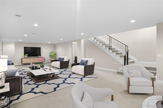 living room featuring baseboards, visible vents, stairs, carpet floors, and recessed lighting