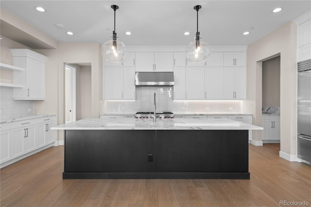 kitchen with open shelves, wood finished floors, white cabinets, and under cabinet range hood