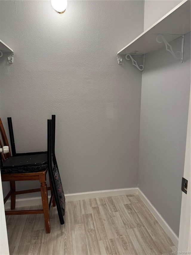 spacious closet featuring light wood finished floors