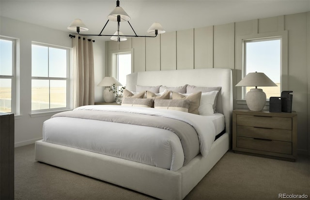 bedroom featuring a chandelier and light colored carpet