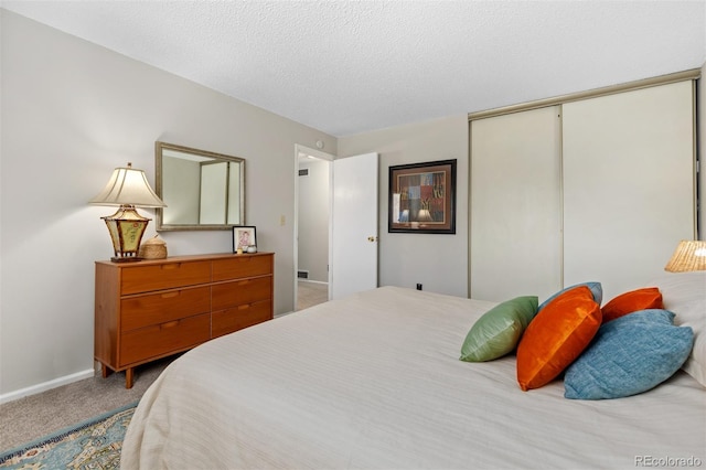 1204 Catalpa Cir, Broomfield, CO 80020 - bedroom with carpet flooring, a closet, and a textured ceiling