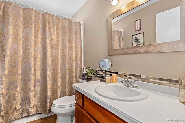 1204 Catalpa Cir, Broomfield, CO 80020 - bathroom with vanity, backsplash, and curtained shower