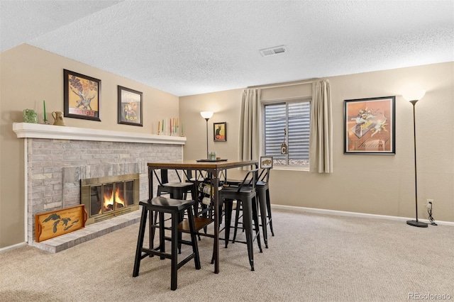 1204 Catalpa Cir, Broomfield, CO 80020 - carpeted dining room featuring a textured ceiling and a fireplace