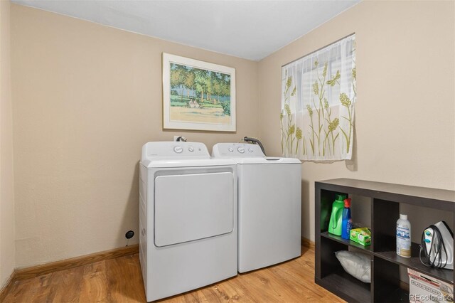1204 Catalpa Cir, Broomfield, CO 80020 - washroom featuring separate washer and dryer and light wood finished floors