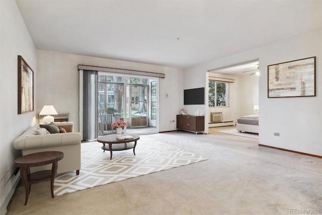 carpeted living room featuring ceiling fan and baseboard heating