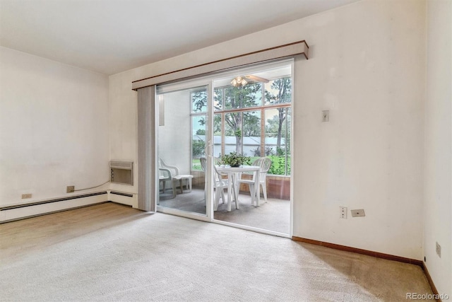 carpeted spare room with a baseboard radiator