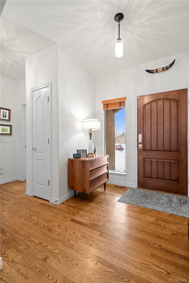 foyer with light wood-type flooring