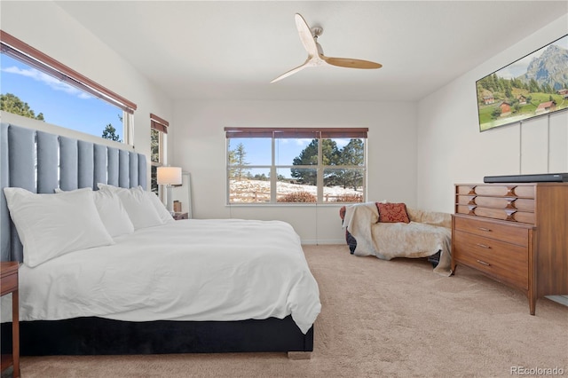 bedroom featuring ceiling fan and light colored carpet