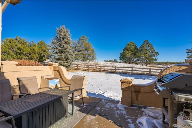 view of snow covered patio