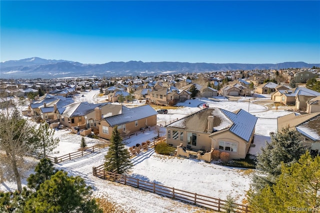 snowy aerial view with a mountain view