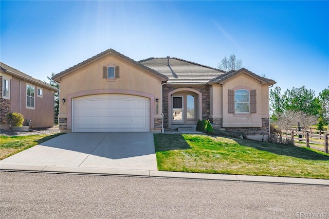 2663 Cinnabar Rd, Colorado Springs, CO 80921 - ranch-style home with stucco siding, an attached garage, driveway, and stone siding