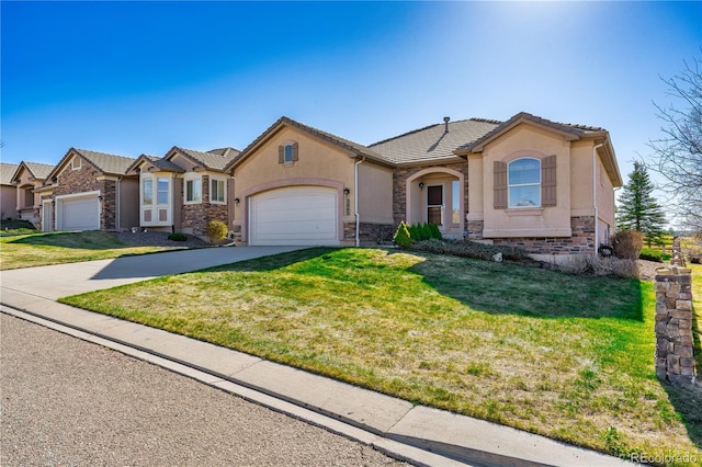 2663 Cinnabar Rd, Colorado Springs, CO 80921 - view of front of property featuring a garage, stucco siding, driveway, and stone siding
