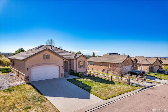 2663 Cinnabar Rd, Colorado Springs, CO 80921 - single story home with a front lawn, fence, stucco siding, concrete driveway, and an attached garage