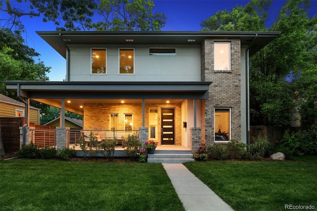 2377 S Humboldt St, Denver, CO 80210 - view of front of house with brick siding and covered porch