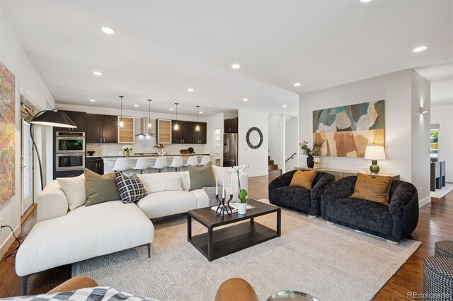 2377 S Humboldt St, Denver, CO 80210 - living area with stairs, recessed lighting, and wood finished floors